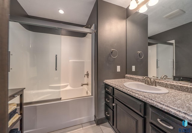 3909 E Shepherd St, Sioux Falls, SD 57103 - bathroom featuring vanity, shower / bath combination with glass door, and tile patterned flooring