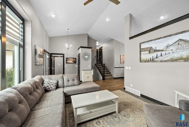 3909 E Shepherd St, Sioux Falls, SD 57103 - living area with wood finished floors, lofted ceiling, stairs, a ceiling fan, and baseboards