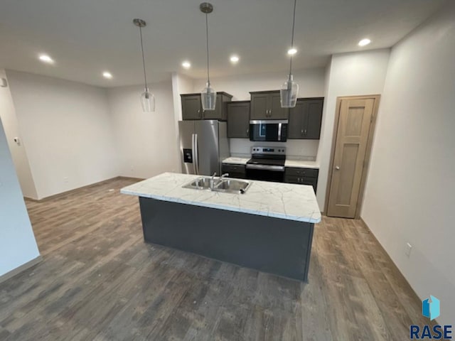 3408 S Heather Ave, Sioux Falls, SD 57106 - kitchen featuring appliances with stainless steel finishes, dark wood-type flooring, a sink, light countertops, and recessed lighting