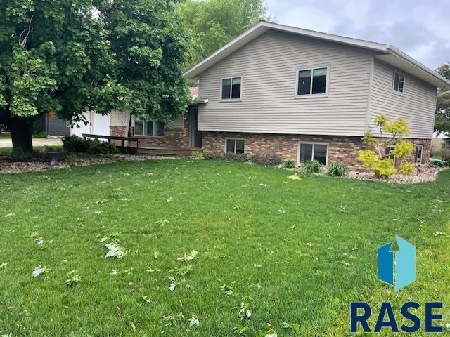 218 S Douglas St, Inwood, IA 51240 - back of house with a yard