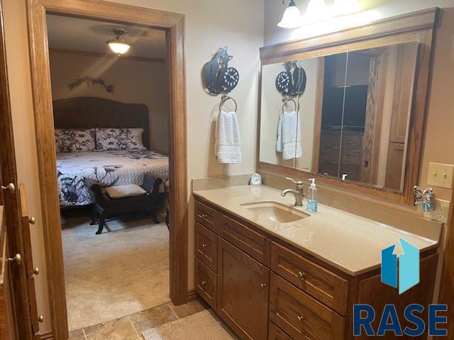 218 S Douglas St, Inwood, IA 51240 - ensuite bathroom featuring vanity