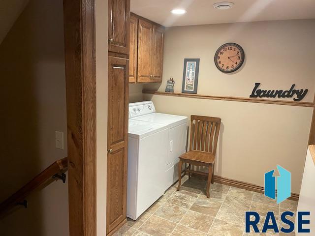 218 S Douglas St, Inwood, IA 51240 - laundry room featuring cabinet space, washer and clothes dryer, and recessed lighting
