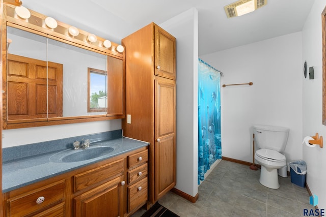 39240 210th St, Huron, SD 57350 - bathroom featuring vanity, toilet, baseboards, a shower with curtain, and tile patterned flooring