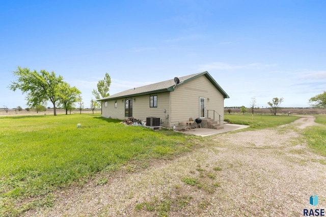 39240 210th St, Huron, SD 57350 - view of side of home featuring entry steps, cooling unit, and a patio