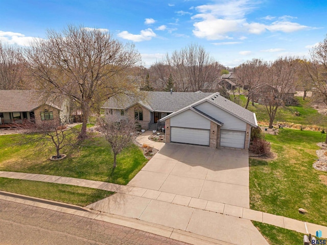 7005 W Strabane Trl, Sioux Falls, SD 57106 - single story home with an attached garage, a front lawn, concrete driveway, and brick siding