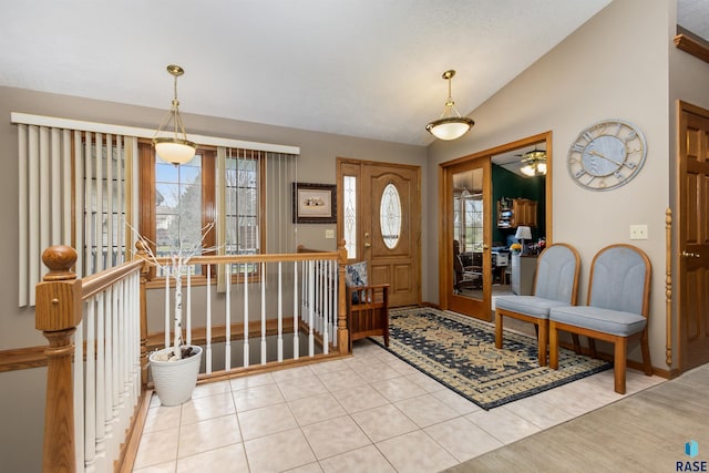 7005 W Strabane Trl, Sioux Falls, SD 57106 - foyer with lofted ceiling, light tile patterned floors, ceiling fan, and baseboards