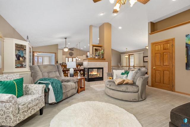 7005 W Strabane Trl, Sioux Falls, SD 57106 - carpeted living room featuring a ceiling fan, vaulted ceiling, recessed lighting, a tile fireplace, and baseboards