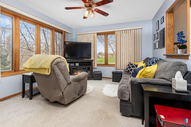 7005 W Strabane Trl, Sioux Falls, SD 57106 - living area with baseboards, ceiling fan, and carpet