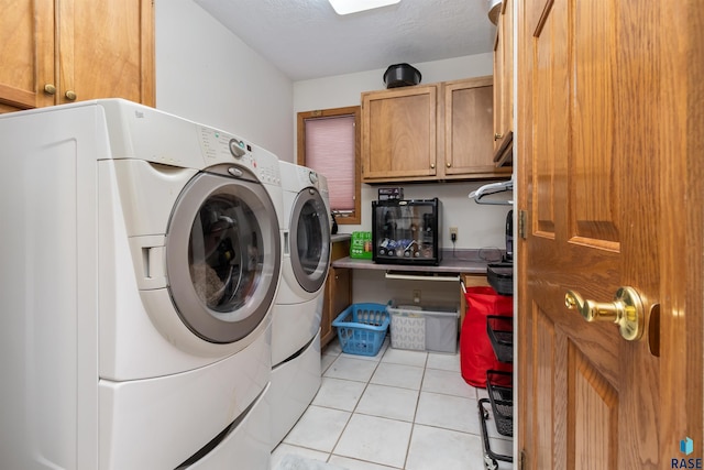 7005 W Strabane Trl, Sioux Falls, SD 57106 - laundry room featuring cabinet space, separate washer and dryer, and light tile patterned floors