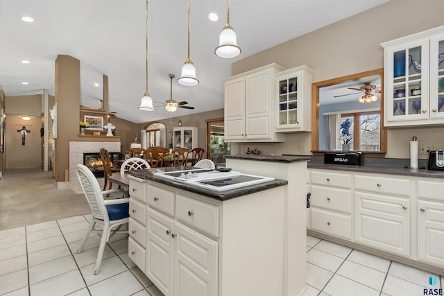 7005 W Strabane Trl, Sioux Falls, SD 57106 - kitchen featuring ceiling fan, white stovetop, a kitchen island, dark countertops, and recessed lighting