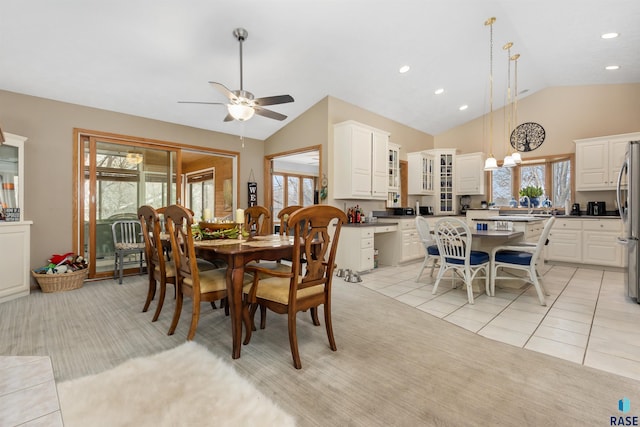 7005 W Strabane Trl, Sioux Falls, SD 57106 - dining room with light colored carpet, a ceiling fan, recessed lighting, light tile patterned floors, and high vaulted ceiling