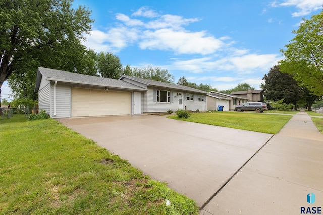 5708 W 46th St, Sioux Falls, SD 57106 - ranch-style house with a front lawn, a garage, and driveway