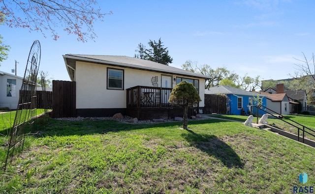 912 N Minnesota Ave, Sioux Falls, SD 57104 - back of house featuring a wooden deck and stucco siding