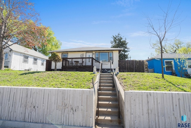 912 N Minnesota Ave, Sioux Falls, SD 57104 - bungalow-style home with stairs, a wooden deck, and stucco siding