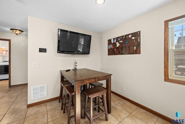912 N Minnesota Ave, Sioux Falls, SD 57104 - dining room with baseboards and light tile patterned flooring