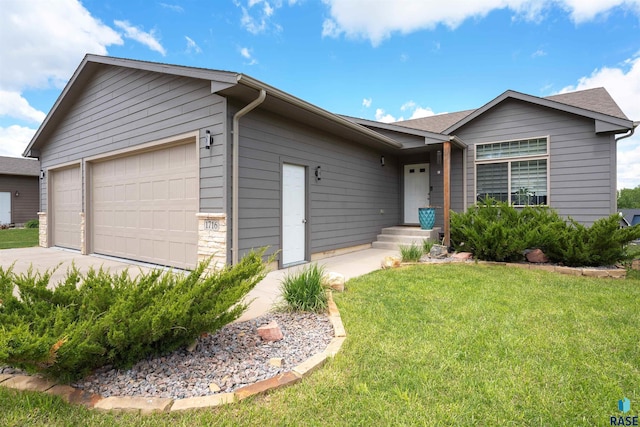 1716 E Tracy Ln, Sioux Falls, SD 57103 - single story home featuring a front yard, concrete driveway, and a shingled roof