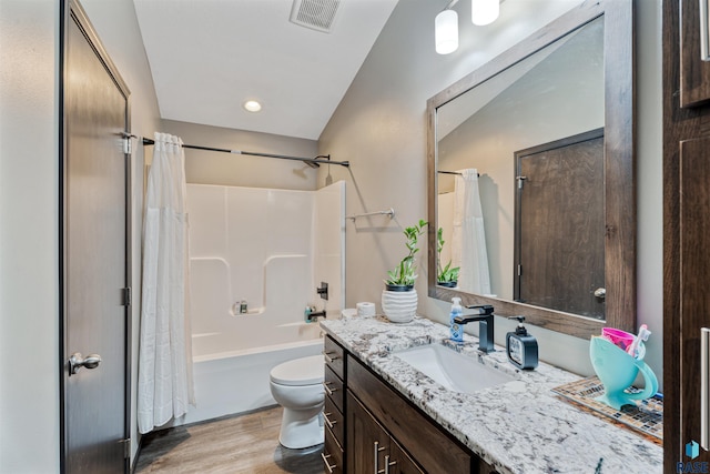 1716 E Tracy Ln, Sioux Falls, SD 57103 - bathroom featuring vanity, wood finished floors, toilet, and shower / bath combination with curtain