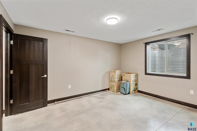 1716 E Tracy Ln, Sioux Falls, SD 57103 - spare room with baseboards and concrete flooring