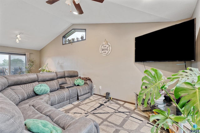 1716 E Tracy Ln, Sioux Falls, SD 57103 - living room featuring vaulted ceiling, a ceiling fan, baseboards, and carpet flooring