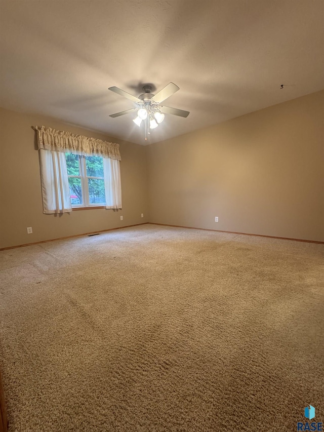 300 W Pipestone Ave, Flandreau, SD 57028 - carpeted empty room featuring baseboards and a ceiling fan