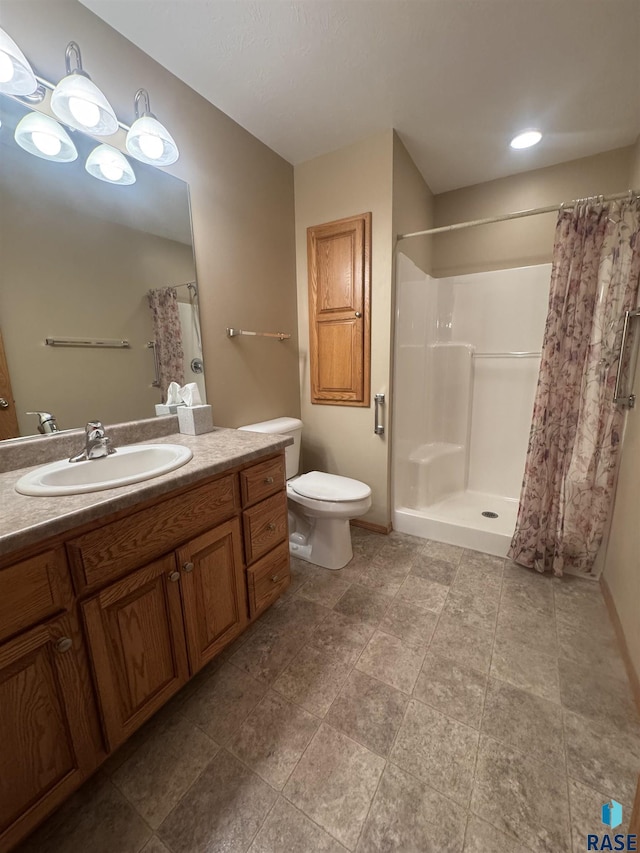 300 W Pipestone Ave, Flandreau, SD 57028 - bathroom with vanity, toilet, and a shower with shower curtain