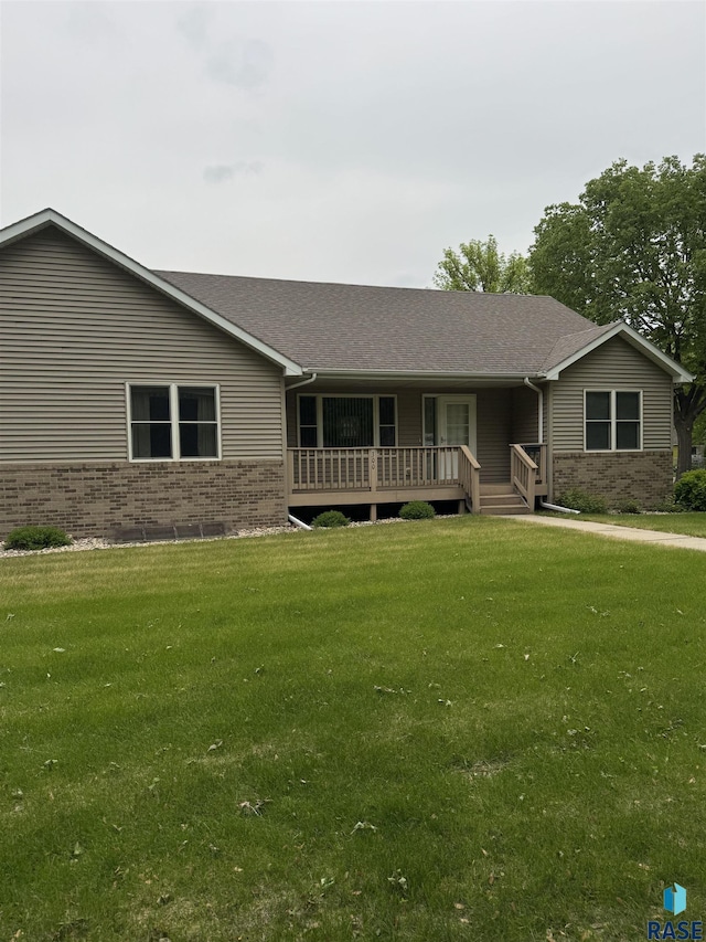 300 W Pipestone Ave, Flandreau, SD 57028 - ranch-style home featuring brick siding and a front yard