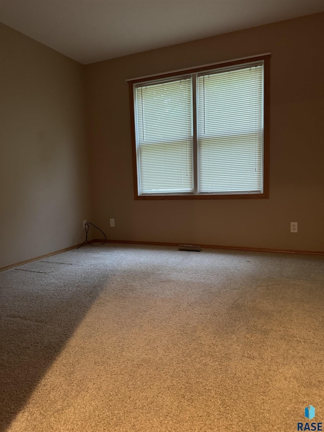 300 W Pipestone Ave, Flandreau, SD 57028 - carpeted spare room featuring baseboards