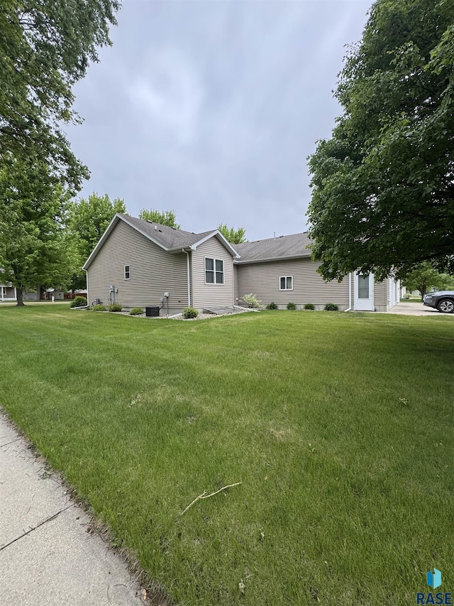 300 W Pipestone Ave, Flandreau, SD 57028 - view of home's exterior featuring a yard and central air condition unit