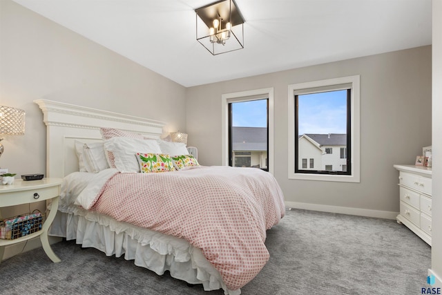212 Autumnwood Ct, Sioux Falls, SD 57110 - carpeted bedroom with a chandelier and baseboards