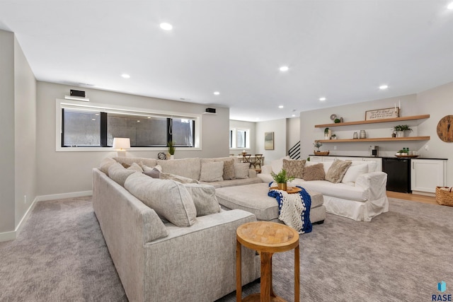 212 Autumnwood Ct, Sioux Falls, SD 57110 - living area with light colored carpet, recessed lighting, baseboards, and a bar