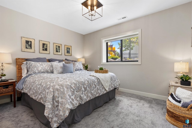212 Autumnwood Ct, Sioux Falls, SD 57110 - carpeted bedroom featuring baseboards and a chandelier