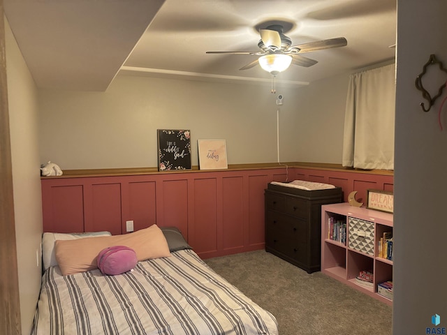 8000 W 44th St, Sioux Falls, SD 57106 - bedroom with a wainscoted wall, carpet floors, a ceiling fan, and a decorative wall