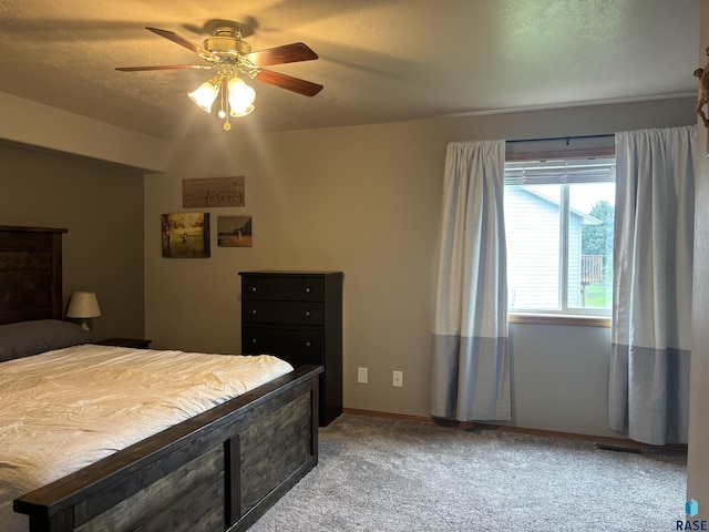 8000 W 44th St, Sioux Falls, SD 57106 - carpeted bedroom featuring a ceiling fan and baseboards