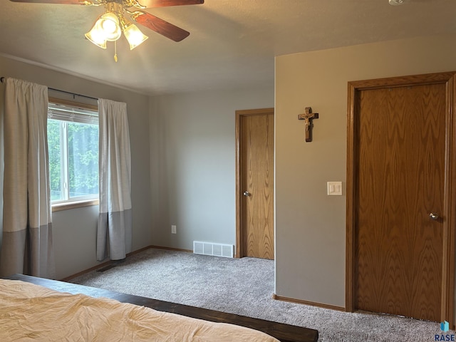 8000 W 44th St, Sioux Falls, SD 57106 - unfurnished bedroom featuring carpet flooring, baseboards, and ceiling fan