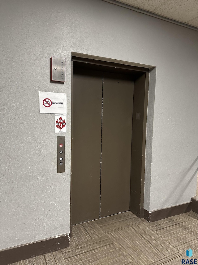 109 E Luverne St Unit 220, Luverne, MN 56156 - elevator featuring baseboards and a textured wall