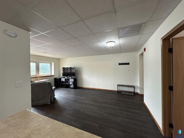 109 E Luverne St Unit 220, Luverne, MN 56156 - hall with wood finished floors, a paneled ceiling, and baseboards