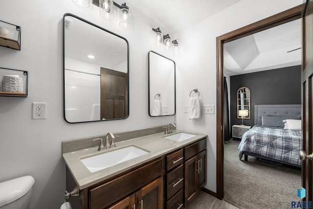622 Creekside Trl, Harrisburg, SD 57032 - bathroom with ensuite bath, double vanity, and toilet