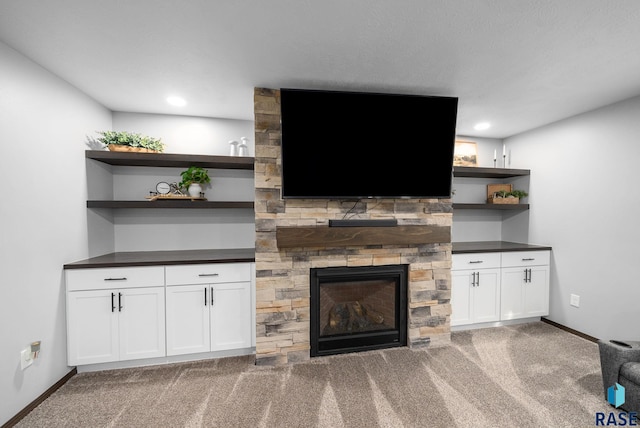 622 Creekside Trl, Harrisburg, SD 57032 - unfurnished living room featuring carpet flooring, a stone fireplace, baseboards, and recessed lighting