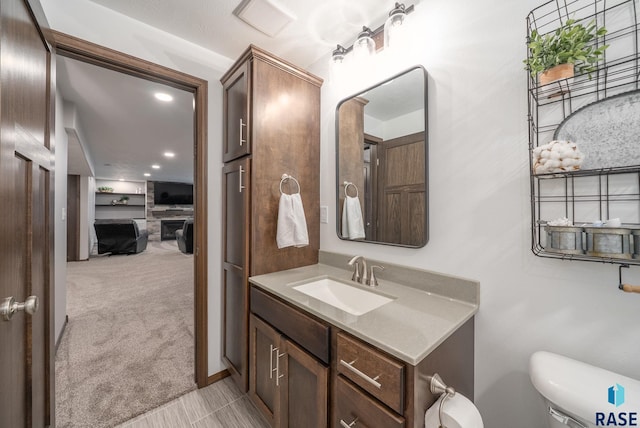 622 Creekside Trl, Harrisburg, SD 57032 - bathroom featuring vanity, toilet, and recessed lighting