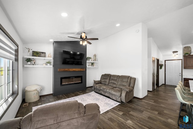 622 Creekside Trl, Harrisburg, SD 57032 - living area with lofted ceiling, a fireplace, dark wood finished floors, ceiling fan, and recessed lighting