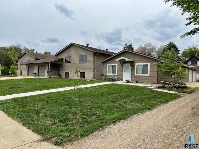 502 E 4th St, Canton, SD 57013 - split level home featuring a garage, driveway, and a front lawn