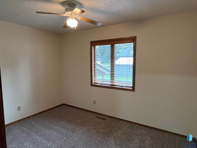 502 E 4th St, Canton, SD 57013 - unfurnished room with carpet flooring, a ceiling fan, and baseboards