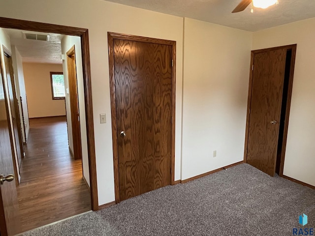 502 E 4th St, Canton, SD 57013 - unfurnished bedroom featuring baseboards, carpet flooring, ceiling fan, and a closet