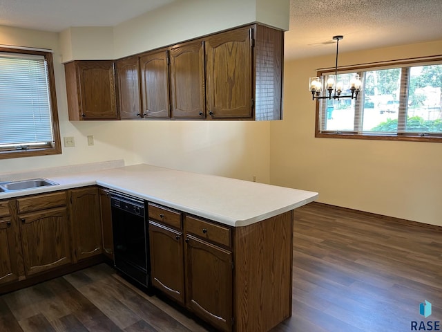 502 E 4th St, Canton, SD 57013 - kitchen featuring black dishwasher, a peninsula, dark wood-type flooring, a chandelier, and light countertops
