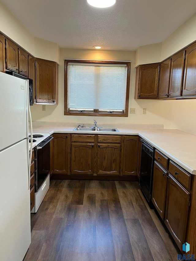 502 E 4th St, Canton, SD 57013 - kitchen with white appliances, a sink, dark wood finished floors, and light countertops