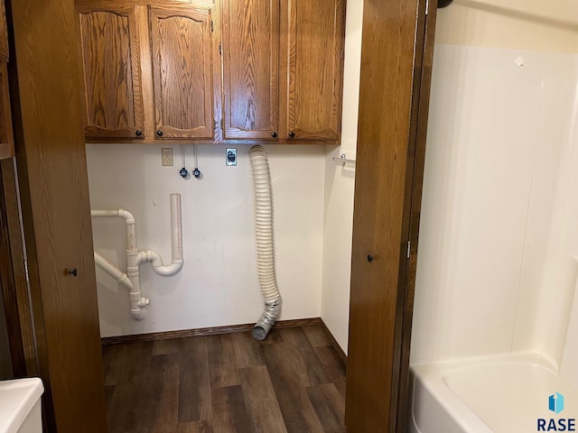 502 E 4th St, Canton, SD 57013 - washroom featuring dark wood-type flooring, baseboards, hookup for a washing machine, and cabinet space