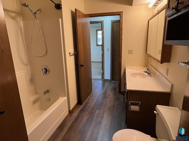 502 E 4th St, Canton, SD 57013 - bathroom with toilet, wood finished floors, shower / bathtub combination, vanity, and baseboards