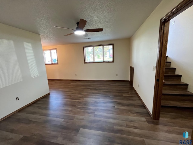 502 E 4th St, Canton, SD 57013 - spare room featuring a ceiling fan, wood finished floors, a textured ceiling, stairway, and baseboards