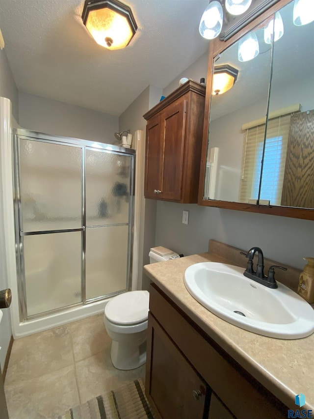 4604 S Woodwind Ln, Sioux Falls, SD 57103 - bathroom with vanity, a stall shower, toilet, and tile patterned floors
