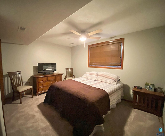 4604 S Woodwind Ln, Sioux Falls, SD 57103 - bedroom with light colored carpet and ceiling fan